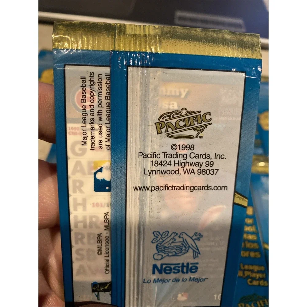 1998 Pacific Nestle Unopened Packs (7). HOF Visible On Back P. Martinez & Others